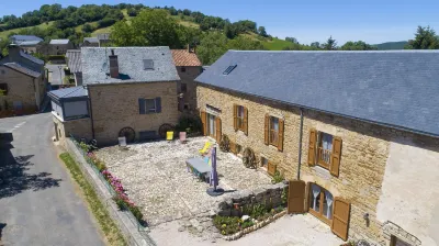 Entre Dolmens et Fontaines - Chambres et tables d'hôtes Hôtels à : Buzeins