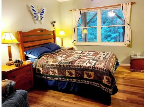 Spacious suite surrounded by nature with living room, fireplace, porch, fire pit