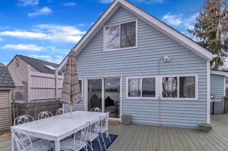 Beautiful 4-bedroom  Lake Front Cottage with HOT TUB & rentable BOAT