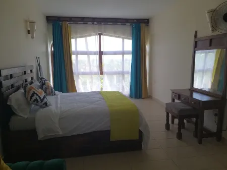 Beachfront studio apartment in a diani beach area with a 180 degree ocean views.