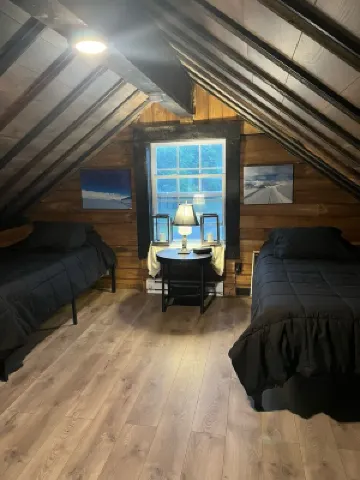 Nestled along the Mettowee River this charming  2-bedroom cabin in  Whitehall