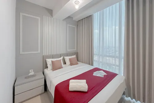 Combined Grey Toned 2BR Apartment at The City Square Surabaya By Travelio