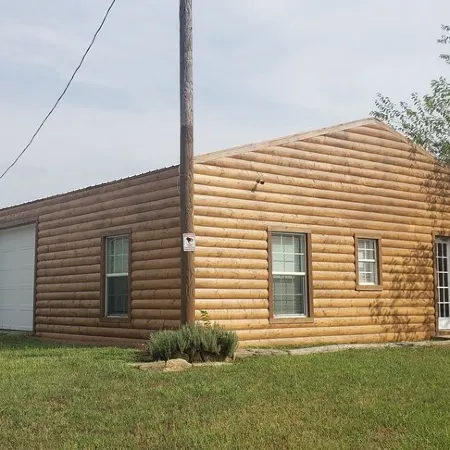 Modern Log Cabin with indoor and outdoor jacuzzi tubs