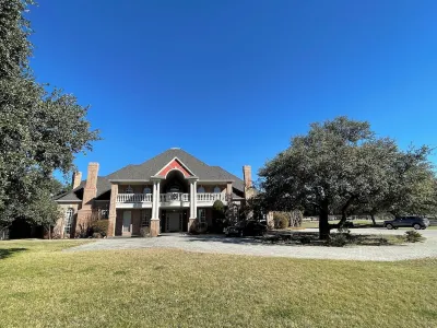 Country Mansion Estate w 5 King Bedrooms 60 Acres & Lakes w Resort-Style Pool Hotels near Peaster Elementary School