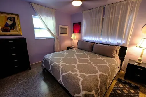 Located steps from the ocean, offering true beach living.