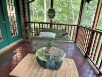 Creekfront Cabin with Waterfall. Hot Tub, Fire Pit, Gameroom, and more.