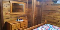 Adventurer's  Lodge, a charming 3-bedroom cabin with WiFi in quiet Lansing, WV.