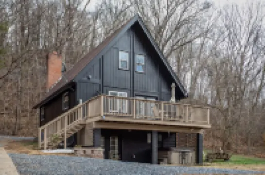 Modern Riverfront A-Frame Cabin w/ Hot Tub, Fire Pit, Kayaks, Canoe, & Arcade