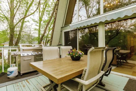 Rustic Riverside A-Frame Retreat: Secluded Charm.