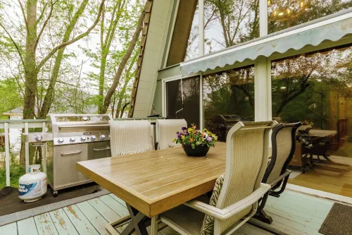 Rustic Riverside A-Frame Retreat: Secluded Charm.