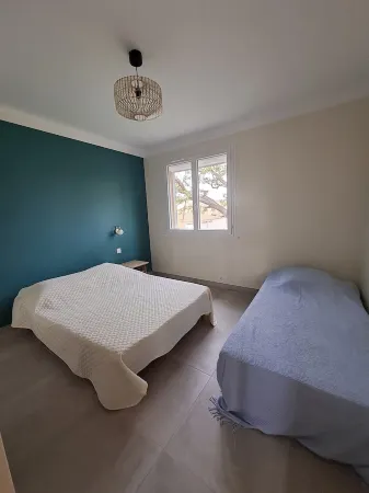 Apartment with balcony upstairs of a villa 300 m from the sea