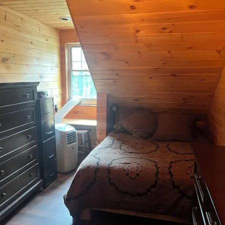 Charming cabin in wonderful New Sweden with 80 acres of woods and trails
