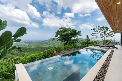 Mountainside Home with Modern Design Sweeping Ocean Views & Private Swimming Pool