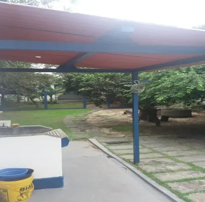 home Beach Center, wooded and grassy yard with fruit trees.