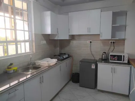 It's an apartment with necessary amenities including a gym