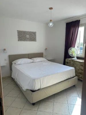 APARTMENT WITH SEA VIEW TERRACE Hotels in Tanaunella