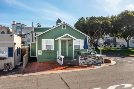 Across quiet street from sandy beach.