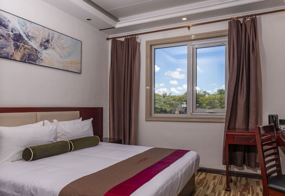 The hotel room at Villa Astoria Sure Inn by Best Western includes a bed or beds at Kalipano Country Hotel