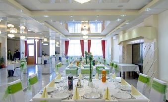 a large banquet hall with tables and chairs set up for a formal event , possibly a wedding reception at Hotel Seneca