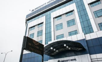 "a modern hotel building with a sign that reads "" prescott hotel "" prominently displayed on the front of the building" at RHR Hotel Kajang