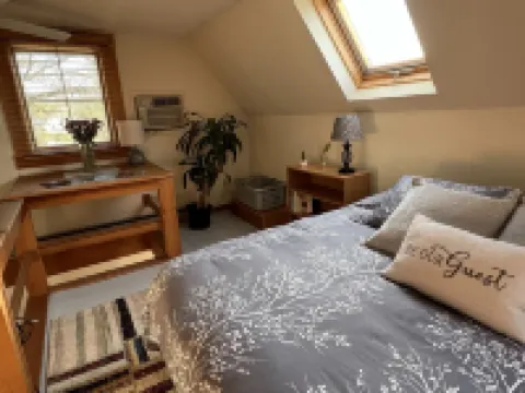 Home with a spring-fed pond and mountain view.