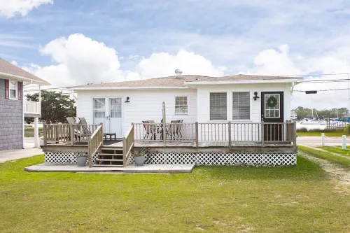 Classic Beach Cottage with front porch view of water