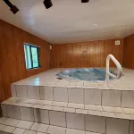 The Woodland Hideout by the Lake Features a Private Hot Tub and Sauna