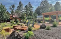Cheerful Cabin with large stone patio and hot tub, next to trails!!