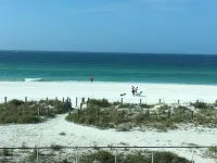 Family beach condo. Steps to sand and restaurants + bars!