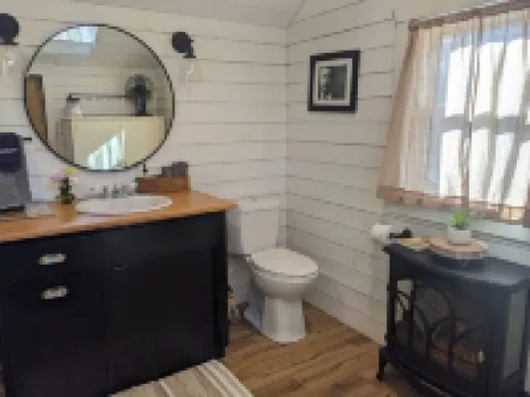 Custom Design Safari Tent Overlooking a Serene Running Creek & Natural Waterfall