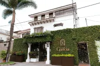 Casa García Hotels near Village Plaza