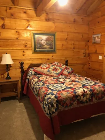 Cozy Cabin in the Woods in a Relaxing Area with Wrap Around Porch Rocking Chairs