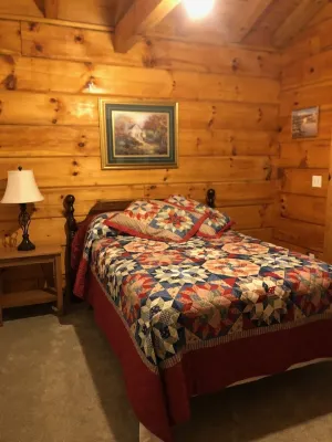 Cozy Cabin in the Woods in a Relaxing Area with Wrap Around Porch Rocking Chairs