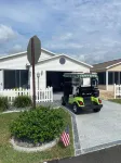 Refurbished villa with golf cart, great location, corner lot