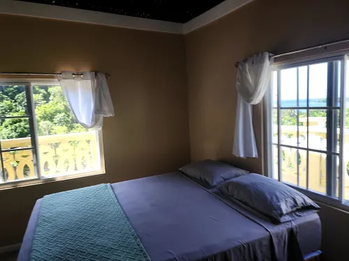 Charming 2-Bedroom Retreat with AC, Sea & Mountain Views, Steps from Downtown!