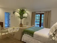 Lush gardens on the Earmen River with heated pool Hotels near Juno Beach Park