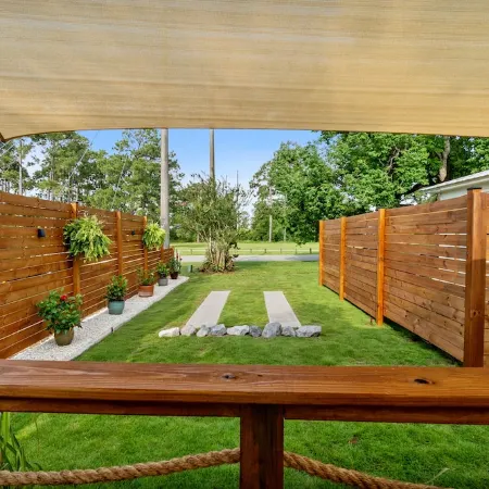 Renovated 1970’s retro camper on Bayou Grande in Pensacola with walking trail.