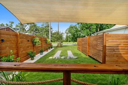 Renovated 1970’s retro camper on Bayou Grande in Pensacola with walking trail.