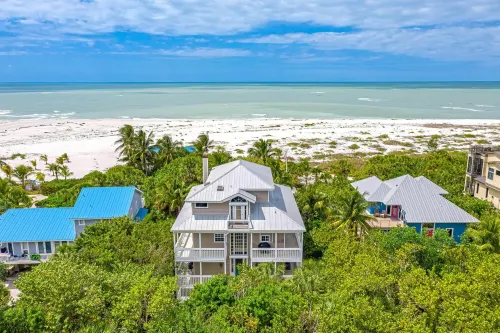 BEACHFRONT, HEATED POOL, KAYAKS/SUP, LANAI W/ GULF VIEWS, 85' DOCK, 2 GOLF CARTS