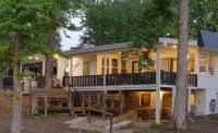 Newly Renovated Lakefront home with boat house, launch and 2 piers!