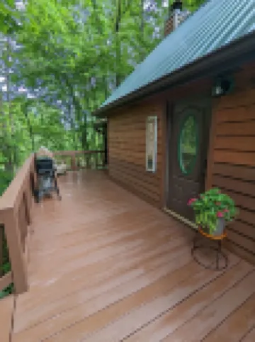 Cozy cabin with wrap around porch and only minutes to town!
