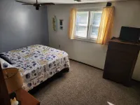 Open concept 2 bedroom ranch with attached garage and deck