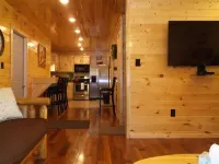 3BR 2 Bath house with full kitchen, living room, and hot tub.