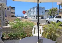 Spacious Living Area and Front Patio - Cozy Family Retreat