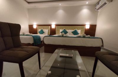 Deluxe Triple Room Hotel De Pebbles Photo