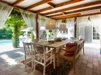 A Detached Bungalow with Outdoor Fireplace Covered Terrace and Pond in a Forest Plot