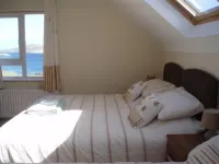 Luxurious Waterfront Holiday Homes with Private Pebble Beach & Free WiFi.