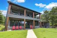 Richland Chambers Lakefront 2-story home with boat dock and pavilions.