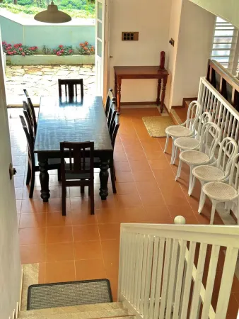 "Thalimala Bungalow, Experience A Vintage Colonial Charm in a Tea-Scaped Haven"