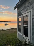 Delightful waterfront cottage with beautiful views of the sunset.